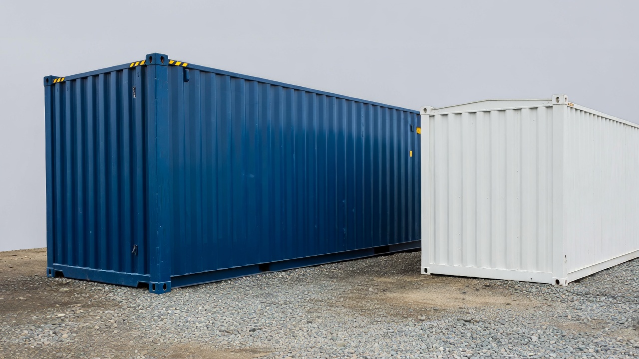 Blue and white shipping containers side by side